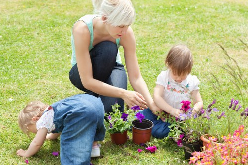 Gardener pruning plants in a Thamesmead garden